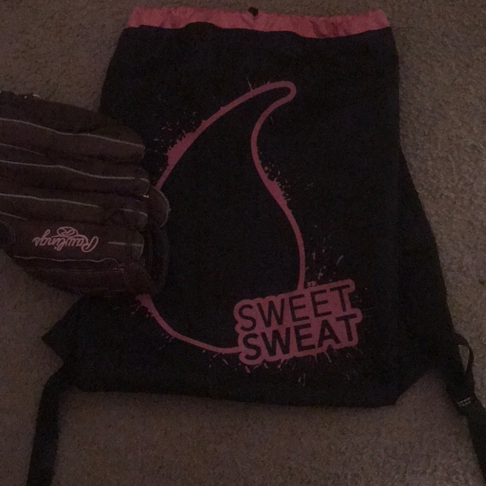 A softball girl gloves and a bag with it